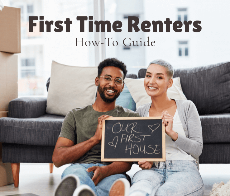 Smiling couple surrounded by moving boxes holding a sign that reads “Our First House,” illustrating a how-to guide for first-time renters.