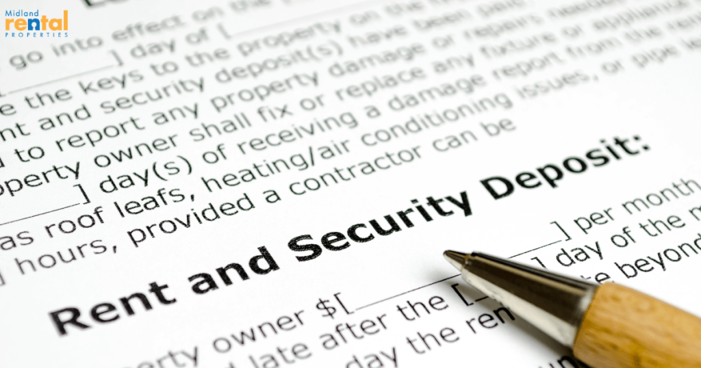 Close-up of a rental lease contract highlighting the section on rent and security deposit with a pen on the paper.