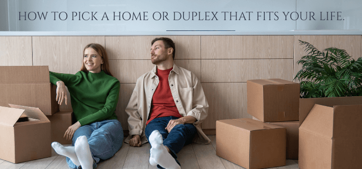 Couple sitting among moving boxes in a Midland, MI rental, choosing between a home or duplex. - feature image