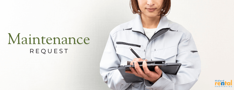 Maintenance worker in uniform writing on a clipboard, representing maintenance request process for Midland MI rental properties.