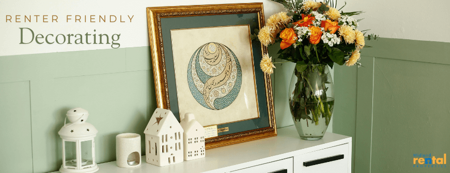 Renter-friendly decorating with framed art and flowers on console table in a Midland, MI rental home